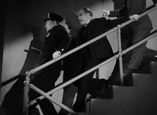 William Demarest, Akim Tamiroff, and Brian Donlevy walking down the stairs.